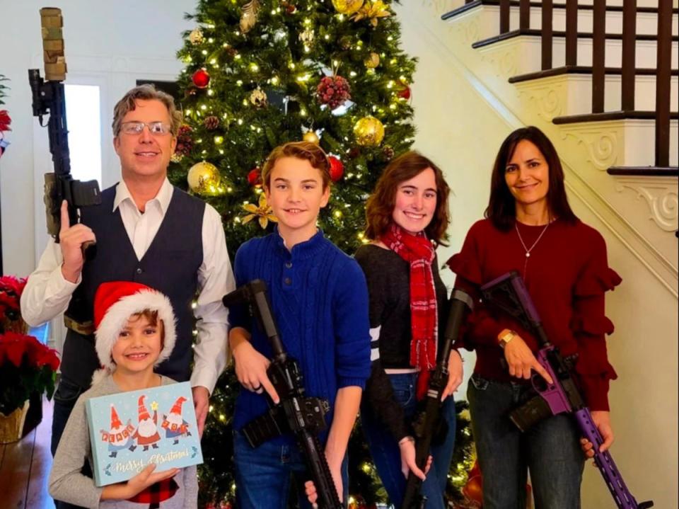 Andy Ogles and his family pose for a 2021 Christmas photo with firearms in an image published on his Facebook page (Facebook / Andy Ogles)