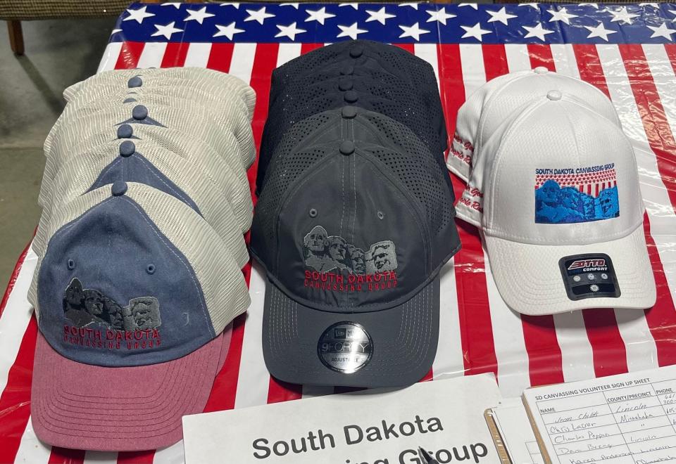 Caps for sale at a South Dakota Canvassing Group event at the Military Heritage Alliance in Sioux Falls, S.D., on Oct. 19, 2023. The group was formed after MyPillow founder Mike Lindell held his Cyber Symposium in Sioux Falls in August 2021.