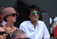 Ronnie Wood watches Great Britain's Andy Murray against Serbia's Novak Djokovic in the stands on day thirteen of the Wimbledon Championships at The All England Lawn Tennis and Croquet Club, Wimbledon.