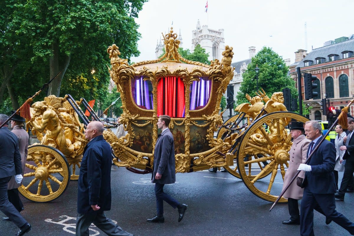 The gold state coach during an early morning rehearsal as service personnel ahead of Sunday's Platinum Jubilee Pageant (PA)