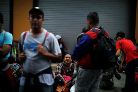 Honduran migrants, part of a caravan trying to reach the U.S., are seen near the border with Mexico, in Tecun Uman, Guatemala October 19, 2018. REUTERS/Ueslei Marcelino