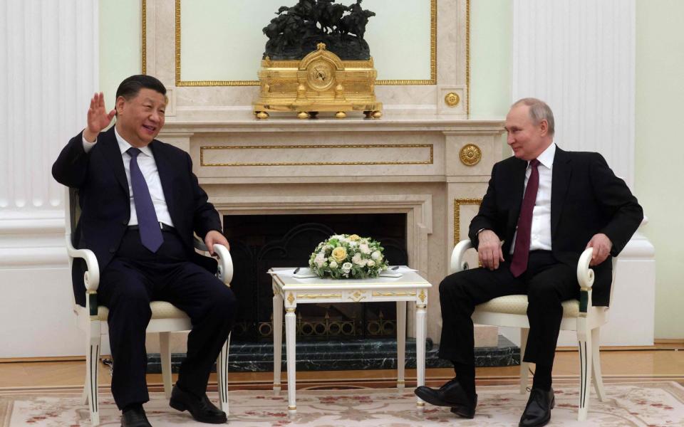 Vladimir Putin China President Xi Jinping sit down for talks at the Kremlin - SERGEI KARPUKHIN/AFP