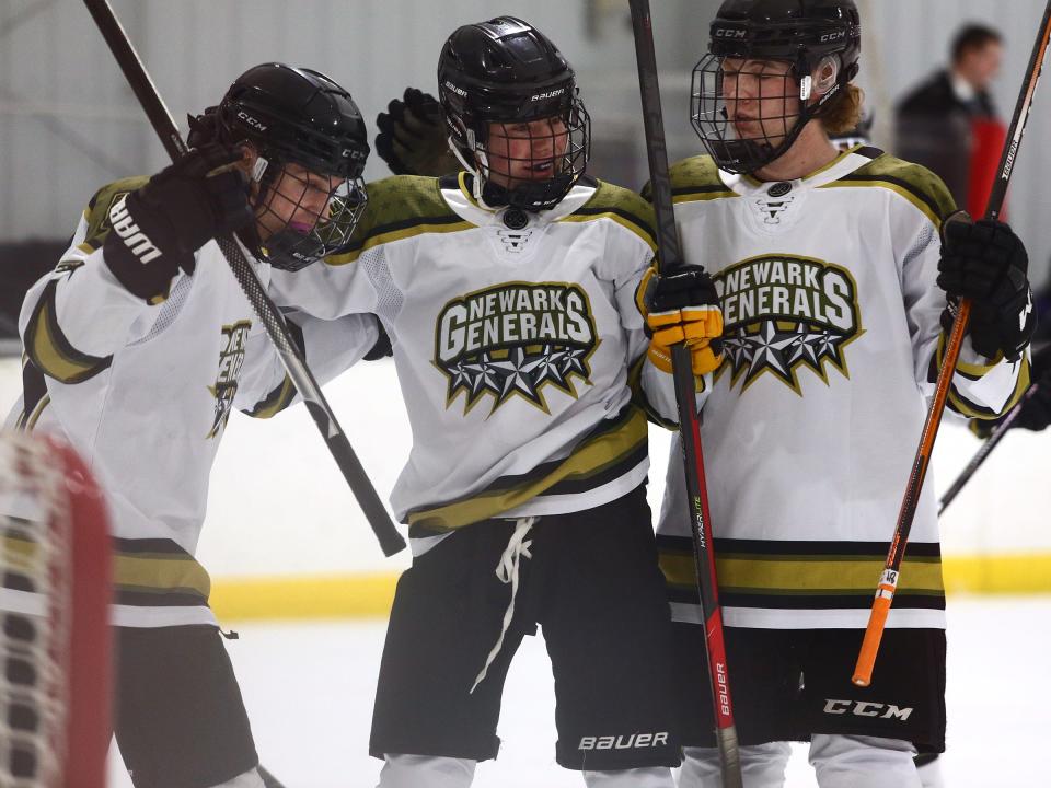 Newark Generals' Evan Spiker, center, celebrates his goal against the PHA Prowlers with teammates on Thursday.