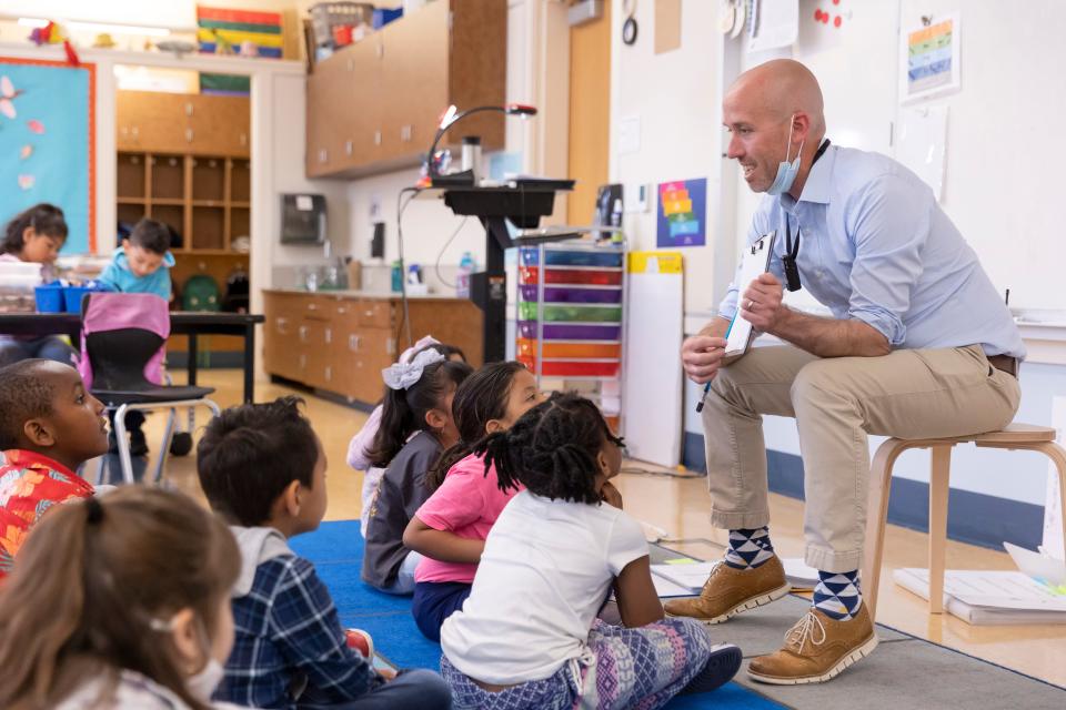 Principal Jamie Allardice teaches a kindergarten class for an absent teacher at Nystrom Elementary in Richmond, Calif.