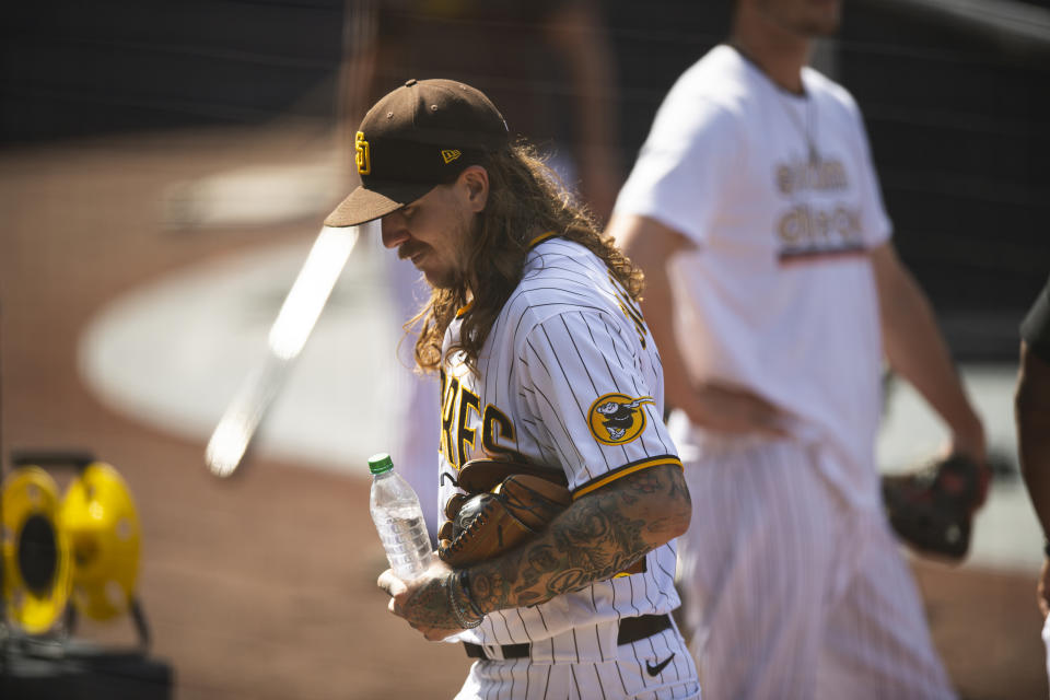 SAN DIEGO, CA - SEPTEMBER 29: Mike Clevinger #52 of the San Diego Padres walks into the dugout after his workout at PETCO Park on September 29, 2020 in San Diego, California.  (Photo by Matt Thomas/San Diego Padres/Getty Images)