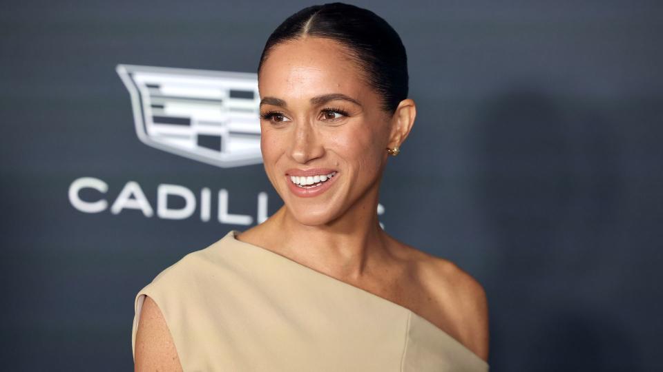 Meghan Markle in a tan dress