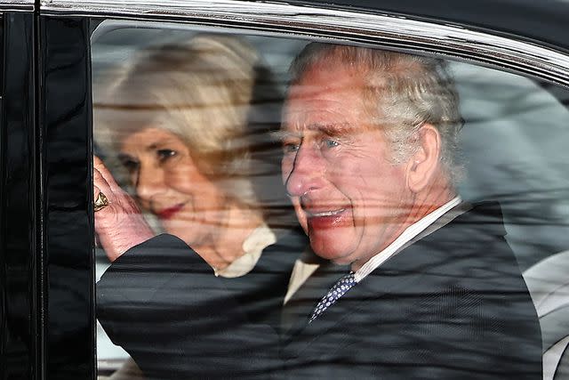 <p>HENRY NICHOLLS/AFP via Getty Images</p> Queen Camilla and King Charles leave Clarence House in London on Feb. 6.
