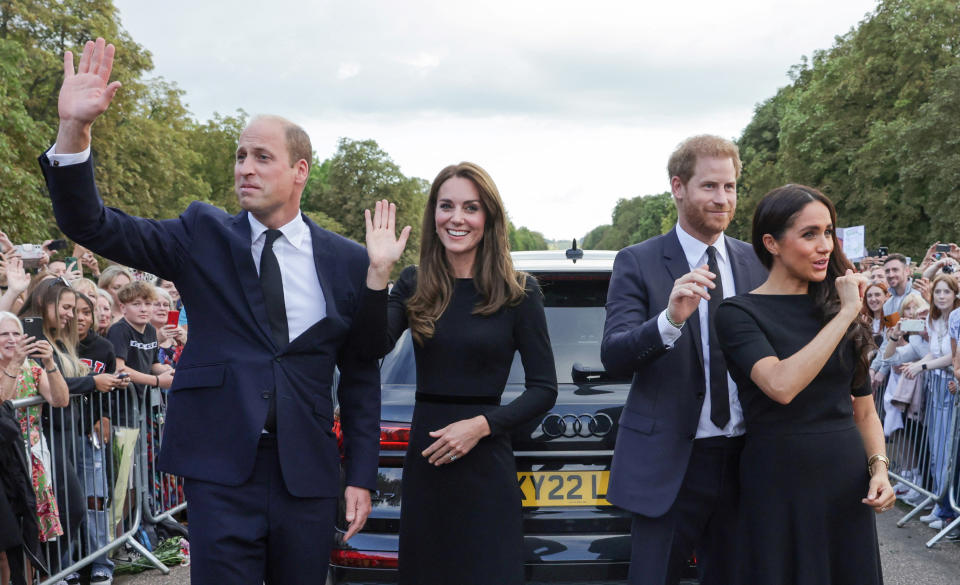 Britain's William, Prince of Wales, Catherine, Princess of Wales, Britain's Prince Harry and Meghan, the Duchess of Sussex, wave to members of the public at Windsor Castle, following the passing of Britain's Queen Elizabeth, in Windsor, Britain, September 10, 2022. Chris Jackson/Pool via REUTERS