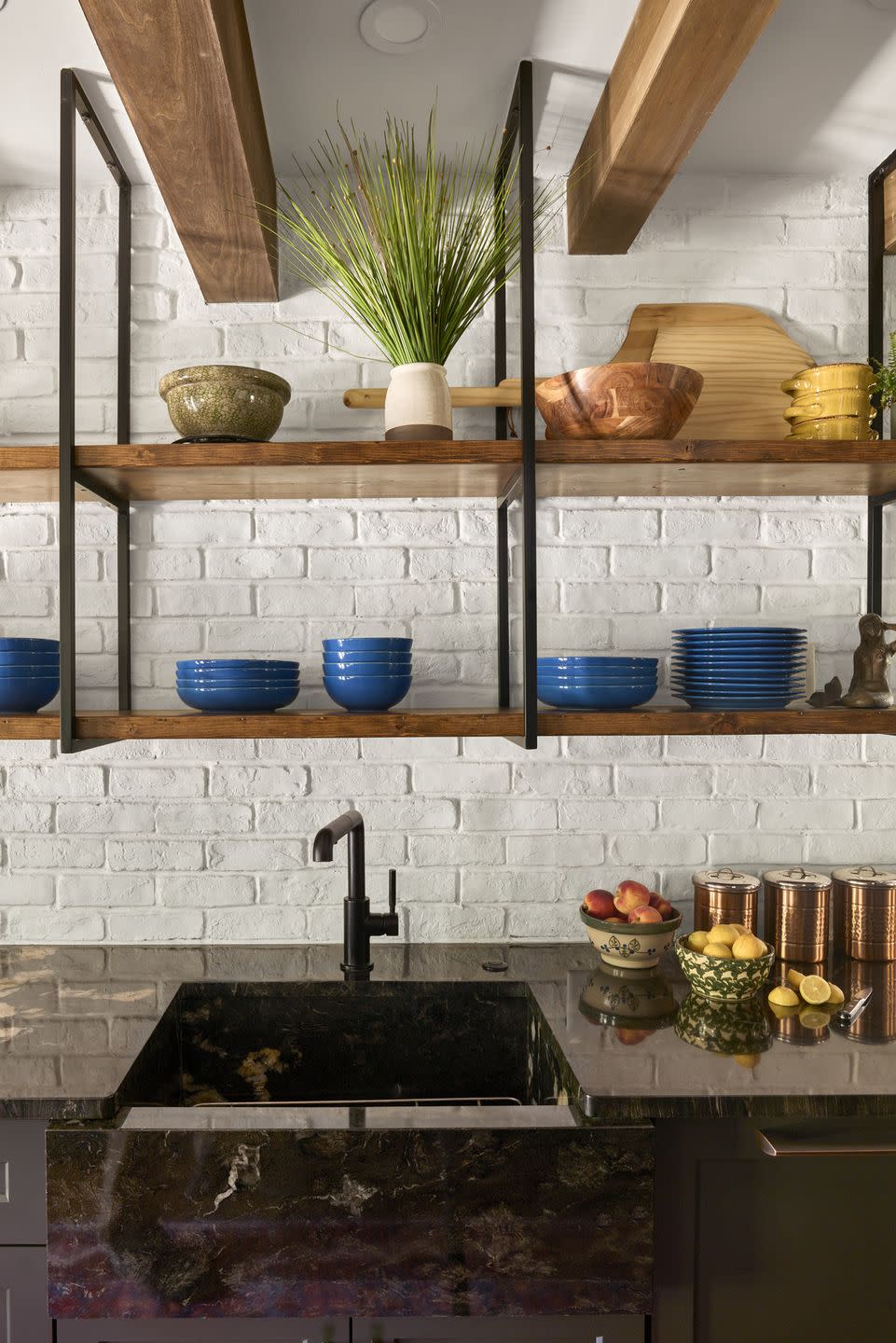 smart shelving to offset dark cabinets and counters, the team wanted the white brick walls to shine through enter custom steel and wood open shelving faucet brizo brick veneer avalon flooring discontinued