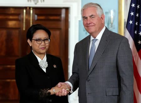 U.S. Secretary of State Rex Tillerson (R) shakes hands with Indonesian Foreign Minister Retno Marsudi before their meeting at the State Department in Washington, U.S., May 4, 2017. REUTERS/Yuri Gripas