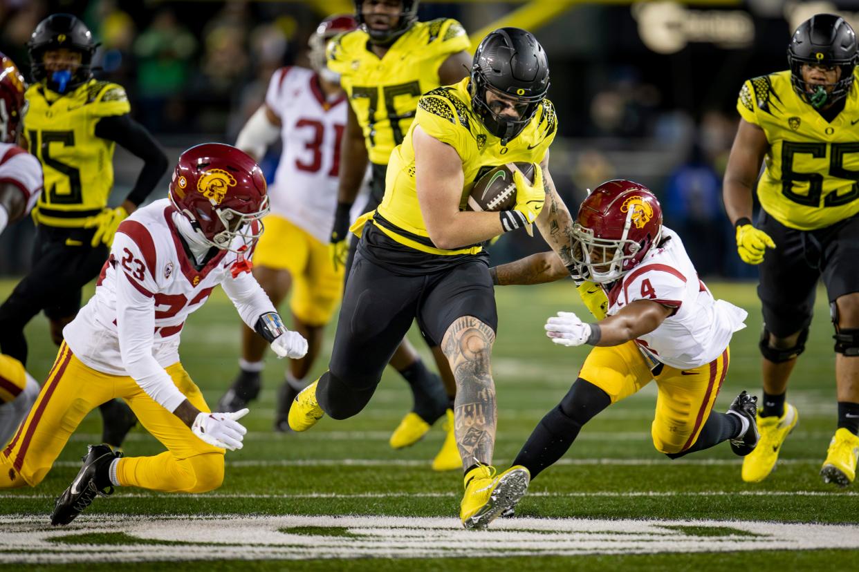 Oregon tight end Terrance Ferguson breaks through a gap in the USC defense as the No. 6 Oregon Ducks host the USC Trojans on Nov. 11 at Autzen Stadium in Eugene.