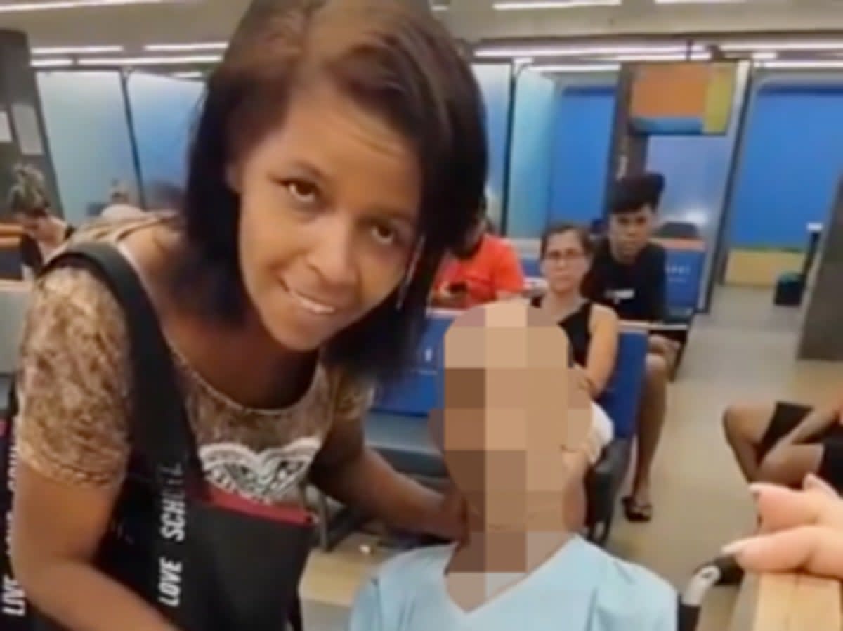 Eika de Souza Vieira Nunes, left, at a bank in Brazil where she attempted to use the corpse of a man she claimed to be her uncle to cosign a bank loan (screengrab/ Daily Mail)