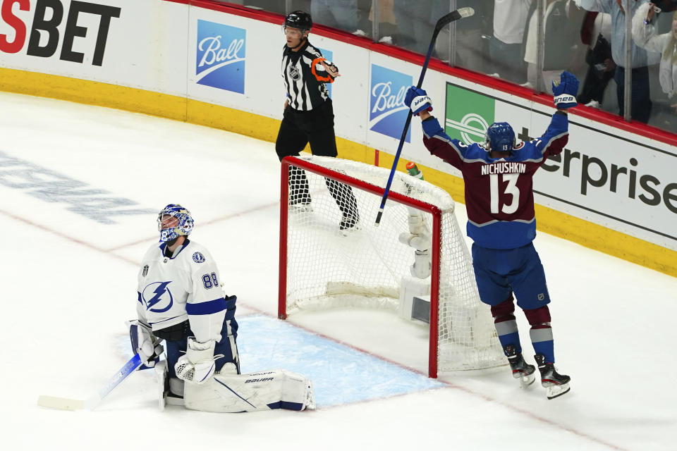 Tampa Bay Lightning goaltender Andrei Vasilevskiy (88) reacts after letting the puck slip past for a goal by Colorado Avalanche right wing Valeri Nichushkin (13) during the first period of Game 1 of the NHL hockey Stanley Cup Final on Wednesday, June 15, 2022, in Denver. (AP Photo/John Locher)