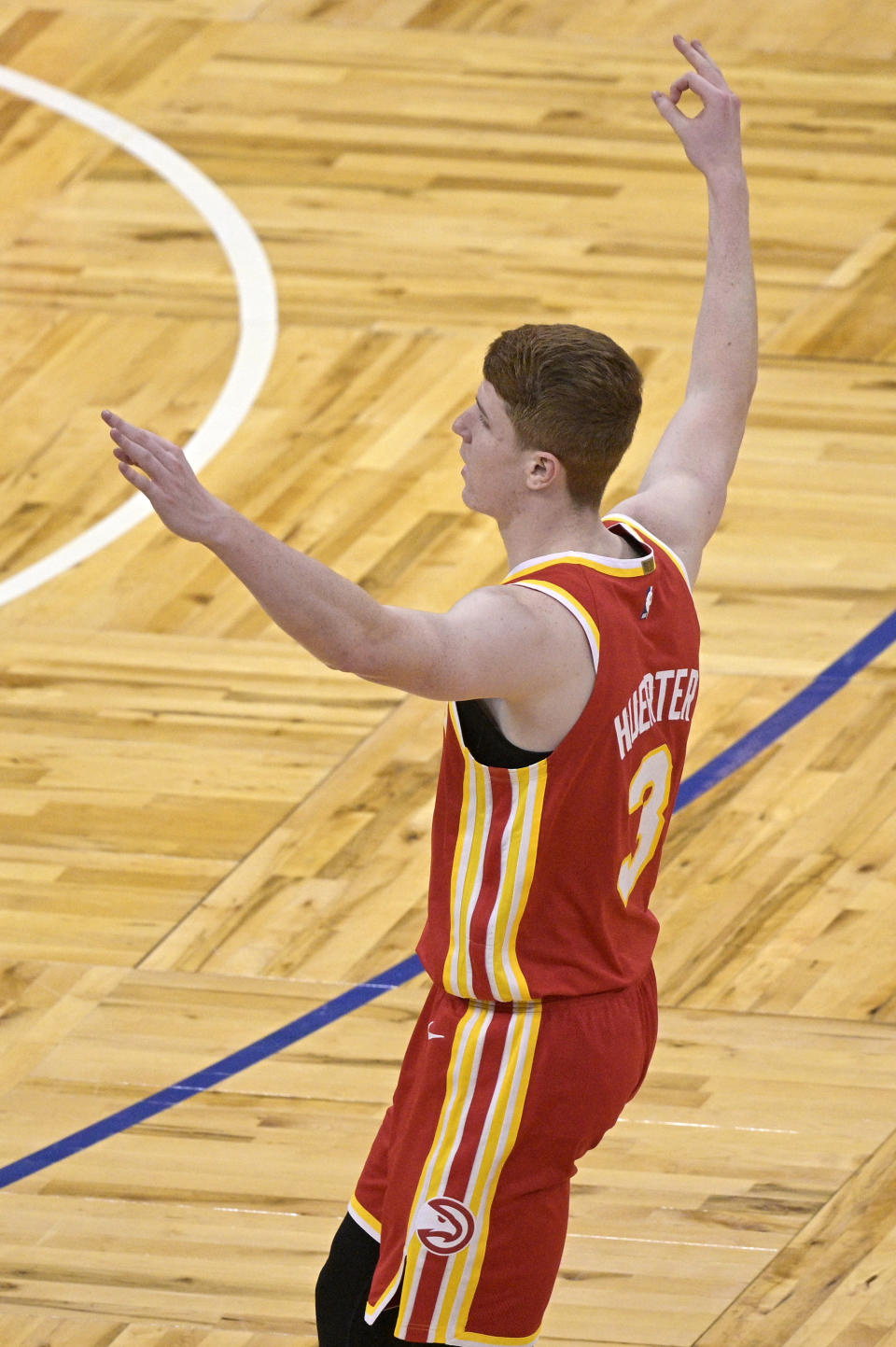 Atlanta Hawks guard Kevin Huerter celebrates after scoring a 3-pointer during the second half of the team's NBA basketball game against the Orlando Magic, Wednesday, March 3, 2021, in Orlando, Fla. (AP Photo/Phelan M. Ebenhack)