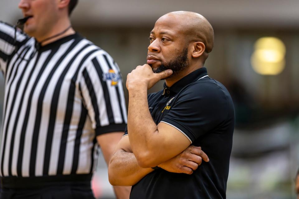 Indianapolis Crispus Attucks High School head coach Chris Hawkins reacts during the first half of an Indianapolis Boys Basketball Tournament semi-final game against Indianapolis Washington High School, Saturday, Jan. 20, 2024, at Arsenal Tech High School.