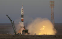 The Soyuz-FG rocket booster with Soyuz MS-11 space ship carrying a new crew to the International Space Station, ISS, blasts off at the Russian leased Baikonur cosmodrome, Kazakhstan, Monday, Dec. 3, 2018. The Russian rocket carries U.S. astronaut Anne McClain, Russian cosmonaut Оleg Kononenko‎ and CSA astronaut David Saint Jacques. (AP Photo/Dmitri Lovetsky)