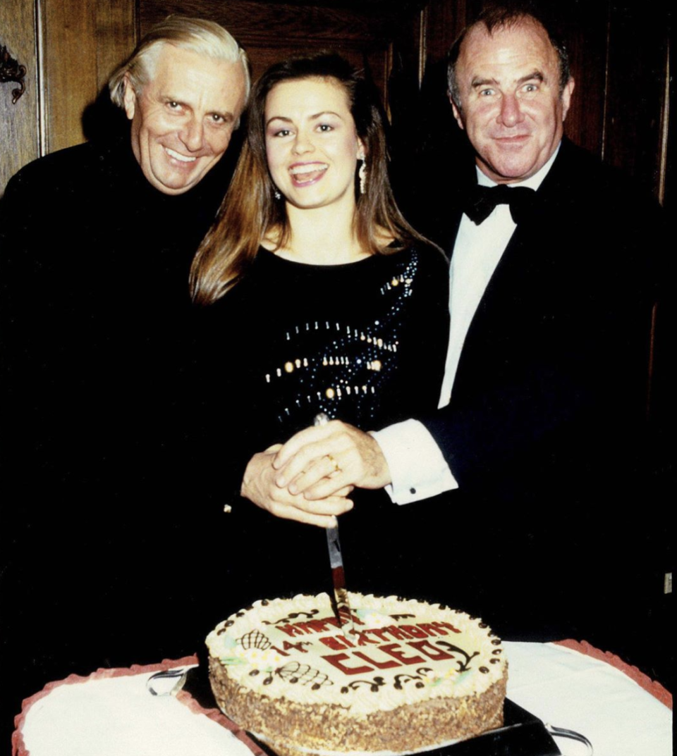 Lisa Wilkinson with Barry Humphries and Clive James cutting a cake at CLEO magazine’s 14th birthday party in 1986.