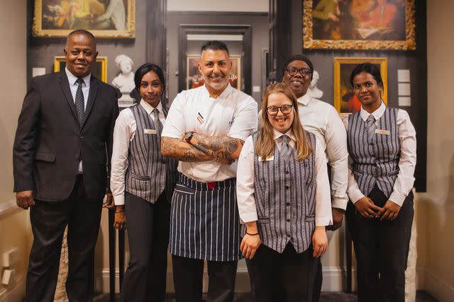 <p>Hilton</p> Mia Dell (center right), an Aurora Foxes grad, poses with the Hilton London Euston food and beverage team.