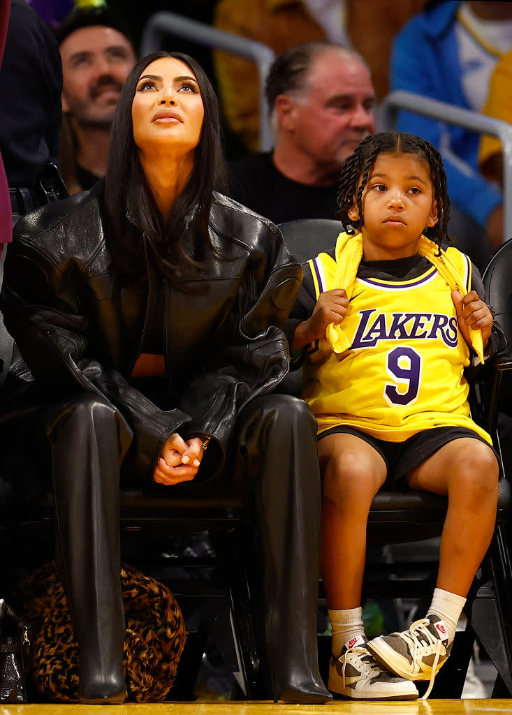LOS ANGELES, CALIFORNIA - APRIL 24:  Kim Kardashian and Saint West during play between the Memphis Grizzlies and the Los Angeles Lakers in the first half of Game Four of the Western Conference First Round Playoffs at Crypto.com Arena on April 24, 2023 in Los Angeles, California.  NOTE TO USER: User expressly acknowledges and agrees that, by downloading and/or using this photograph, user is consenting to the terms and conditions of the Getty Images License Agreement. (Photo by Ronald Martinez/Getty Images)