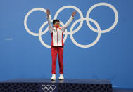 Quan Hongchan of China celebrates after winning the gold medal in women's diving 10m platform final at the Tokyo Aquatics Centre at the 2020 Summer Olympics, Thursday, Aug. 5, 2021, in Tokyo, Japan. (AP Photo/Dmitri Lovetsky)