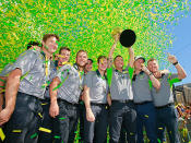 The Aussies lift the trophy in Melbourne.