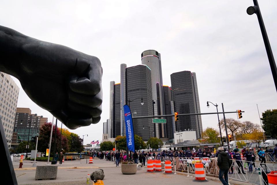 The Joe Louis fist can be seen by marathoners as they make their way down Jefferson Avenue during the 45th Annual Detroit Free Press Marathon in Detroit on Sunday, Oct. 16, 2022.