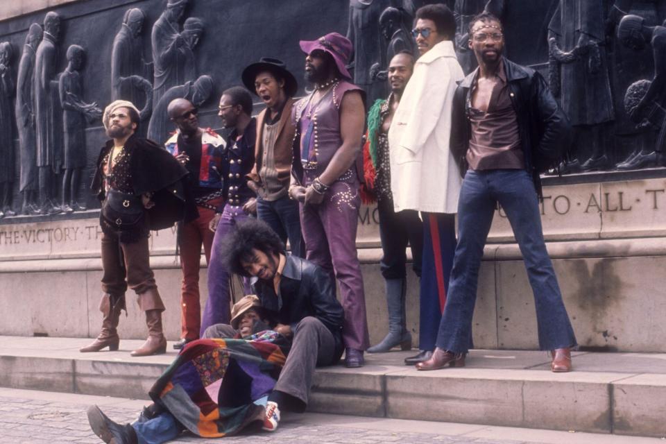 LIVERPOOL, ENGLAND - MAY 1971: (L-R) Fuzzy Haskins, Tawl Ross, Bernie Worrell, Tiki Fulwood, Grady Thomas, George Clinton, Ray Davis, Calvin Simon and seated Eddie Hazel and Billy "Bass" Nelson of the funk band Parliament-Funkadelic pose for a portrait in May 1971 in Liverpool, England. (Photo by Michael Ochs Archives/Getty Images)