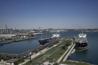 Ships are docked in the Black Sea port of Constanta, Romania, Tuesday, June 21, 2022. While Romania has vocally embraced the ambitious goal of turning into a main hub for the export of agricultural products from Ukraine, economic experts and port operators in the country warn that it was much easier objective to set than to actually achieve. (AP Photo/Vadim Ghirda)