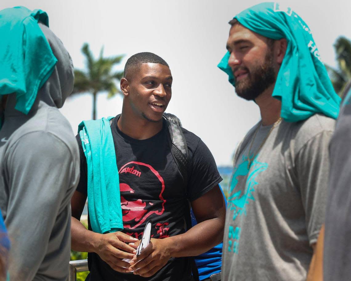 Channing Tindall, left, talks to Skylar Thompson, signed members of the Miami Dolphins rookie class, during a historic walking tour of Downtown Miami with local community groups on Wednesday, June 15, 2022 beginning with tour leaders at the History Miami Museum. Tindall and Thompson are two of the four players of the rookie class actually singed to the roster for this coming season.