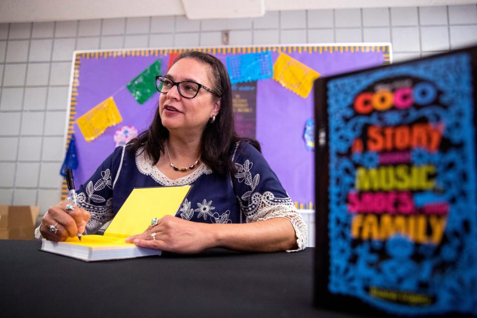 "Coco" author Diana Lopez signs books following a presentation on Thursday, June 27, 2019. Students in the Robstown Independent School District's Summer School Academy  heard from Lopez about her experience as a writer and also the importance of reading.