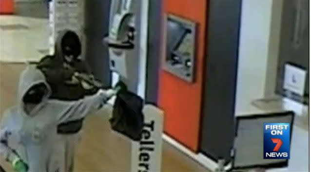 A man and woman wearing balaclavas threatened bank staff in Geelong. Picture: 7 News