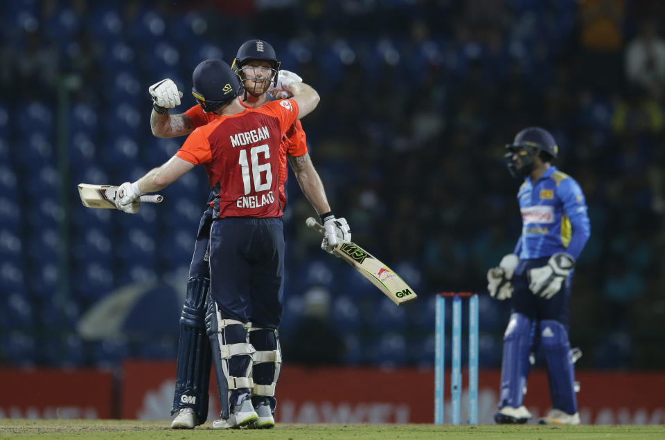 England's Eoin Morgan and Ben Stokes celebrate their teams victory over Sri Lanka by seven wickets in their third one-day international cricket match with Sri Lanka in Pallekele, Sri Lanka, Wednesday, Oct. 17, 2018. (AP Photo/Eranga Jayawardena)