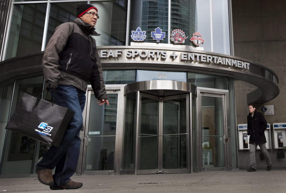 Pedestrians walk past the Maple Leaf Sports + Entertainment office in Toronto Sunday, March 13, 2011. The Ontario Teachers' Pension Plan is looking to sell its 66% share in Maple Leafs Sports and Entertainment (MLSE). THE CANADIAN PRESS/Darren Calabrese