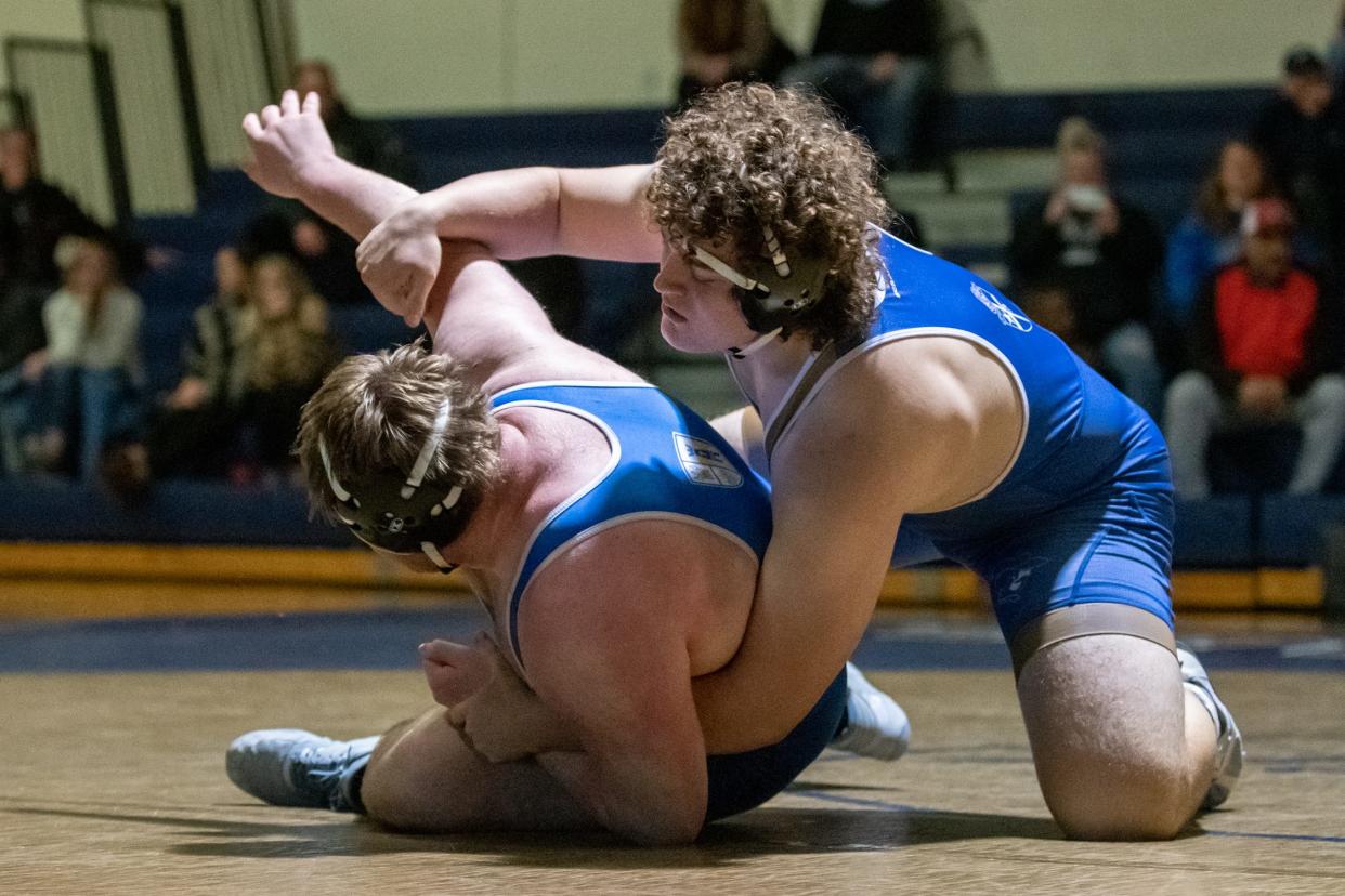 La Salle's Andrew Brennan, right, battles Conwell-Egan's Connor Horger in a 285-pound match in the Philadelphia Catholic League wrestling championship final, on Tuesday, January 30, 2024, at La Salle College High School in Springfield. The Eagles clinched their fourth-straight title win after defeating the Explorers 37-19.