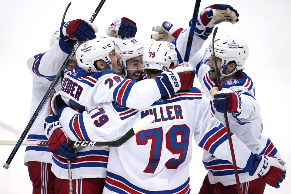 New York Rangers' Chris Kreider (20) celebrates his goal during the third period in Game 6 of an NHL hockey Stanley Cup first-round playoff series against the Pittsburgh Penguins in Pittsburgh, Friday, May 13, 2022. (AP Photo/Gene J. Puskar)