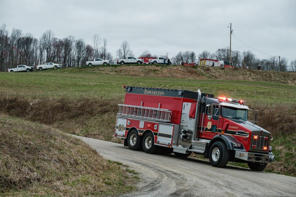 A tanker from the Bowerston Fire Department departs an oil wellhead fire at the CHK Jamar Pad owned and maintained by Encino Energy.