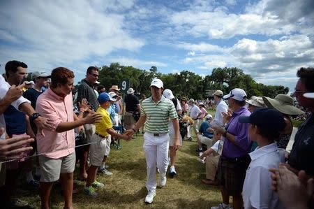 May 8, 2015; Ponte Vedra Beach, FL, USA; Rory McIlroy walks off the course after completing his second round of The Players Championship golf tournament on the 9th hole at TPC Sawgrass - Stadium Course. Mandatory Credit: Jake Roth-USA TODAY