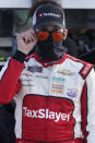 Myatt Snider looks over his sunglasses as he waits to start a NASCAR Xfinity Series auto race, Saturday, Feb. 27, 2021, in Homestead, Fla. Snider won the race at Homestead-Miami Speedway after Noah Gragson slammed into a lapped car with two laps remaining. (AP Photo/Wilfredo Lee)