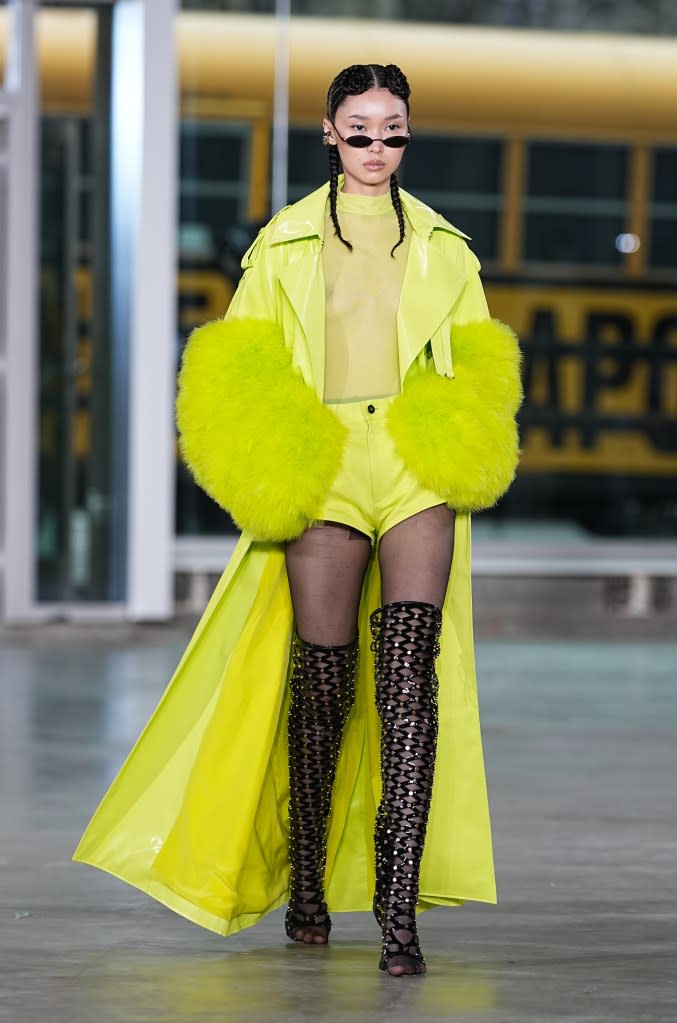 A yellow school bus pulled up in front of the Lapointe show, and the models exited one by one. Sally LaPointe educated the audience on how to wear her traffic-stopping looks. Getty Images