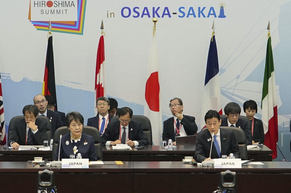 Foreign Minister Yoko Kamikawa, left, and Yasutoshi Nishimura, right, the Japanese minister in charge of trade and the economy, attend a G-7 Trade Ministers' Meeting in Osaka, western Japan, Sunday, Oct. 29, 2023. Trade and economy officials from the Group of Seven wealthy democracies strengthened their pledge Sunday to work together to ensure smooth supply chains for essentials like energy and food despite global uncertainties.(Kyodo News via AP)