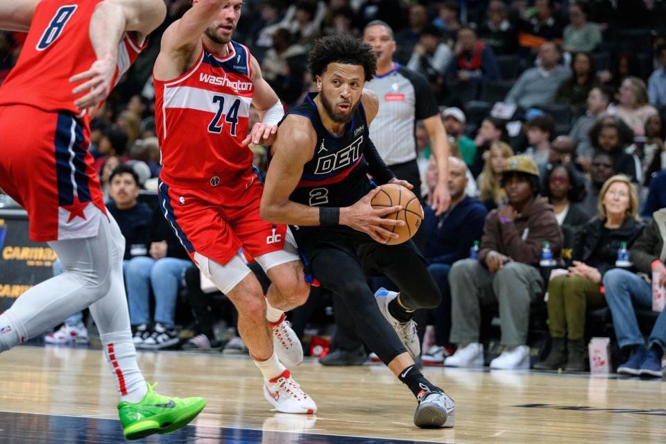 Detroit Pistons guard Cade Cunningham drives to the basket against Washington Wizards forward Corey Kispert during the third quarter at Capital One Arena, Friday, March 29, 2024.