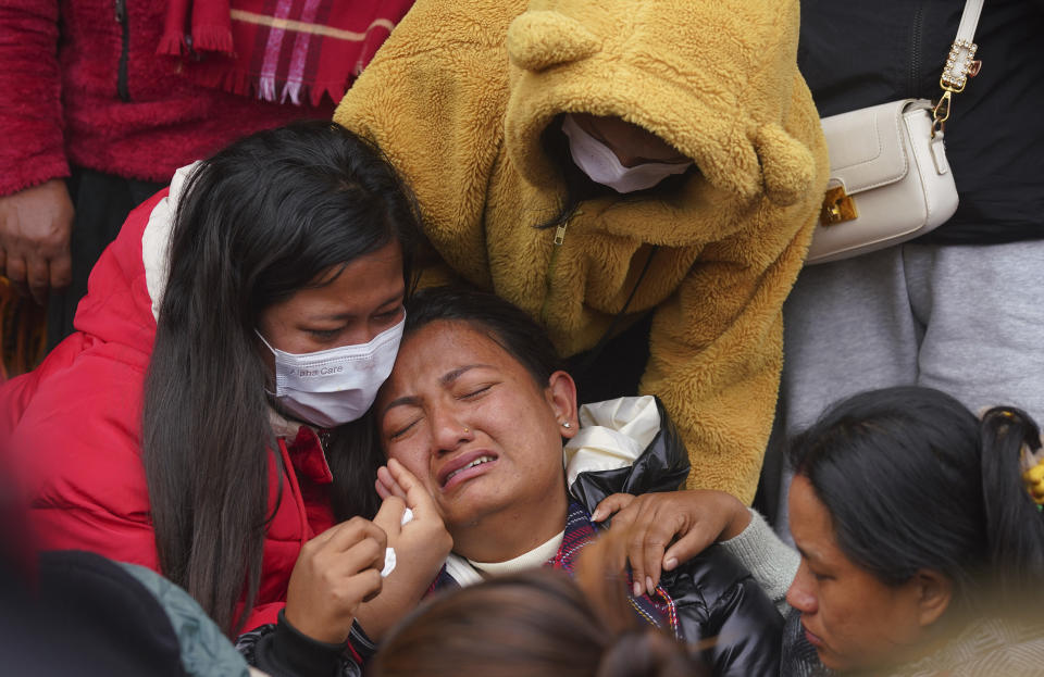 A woman wails as she waits to receive the body of a relative, victim of a plane crash, at a hospital in Pokhara, Nepal, Monday, Jan 16, 2023. Nepal began a national day of mourning Monday as rescue workers resumed the search for six missing people a day after a plane to a tourist town crashed into a gorge while attempting to land at a newly opened airport, killing at least 66 of the 72 people aboard in the country's deadliest airplane accident in three decades. (AP Photo/Yunish Gurung)