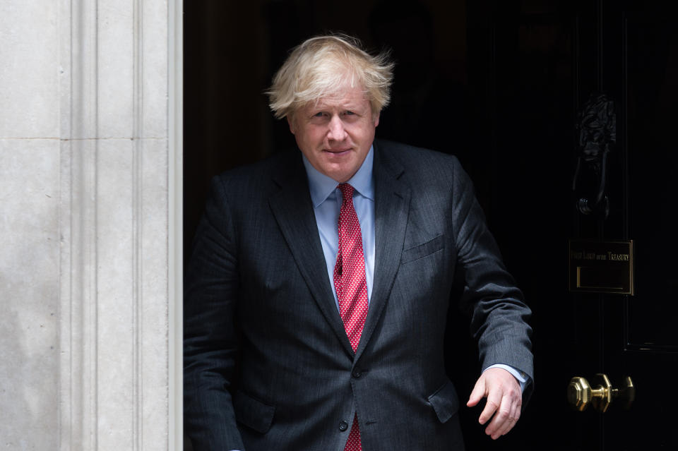 LONDON, UNITED KINGDOM - JUNE 24, 2021: British Prime Minister Boris Johnson welcomes Prime Minister of Libya Abdul Hamid Dbeibah (not pictured) on the steps of 10 Downing Street ahead of their meeting on June 24, 2021 in London, England. (Photo credit should read Wiktor Szymanowicz/Barcroft Media via Getty Images)