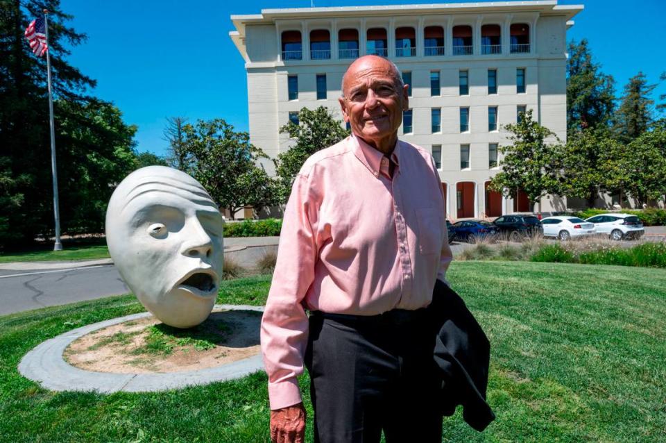 Bob Dunning stands near the Davis School of Law on Tuesday. Dunning has written about Davis for 54 years and despite his layoff from the Davis Enterprise, he says not done yet.