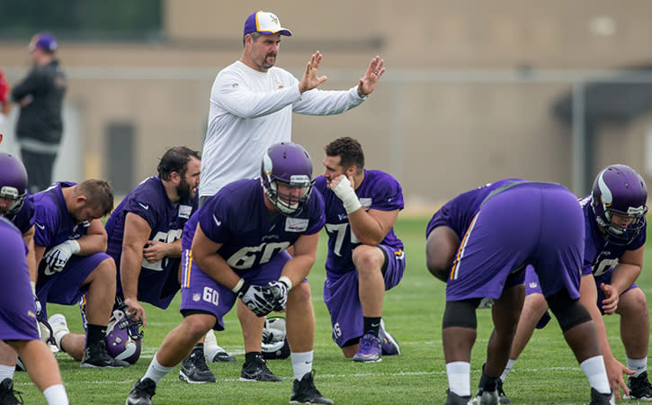 Minnesota Vikings former offensive line coach, Jeff Davidson, instructs his players in drills at training camp at Minnesota State University.