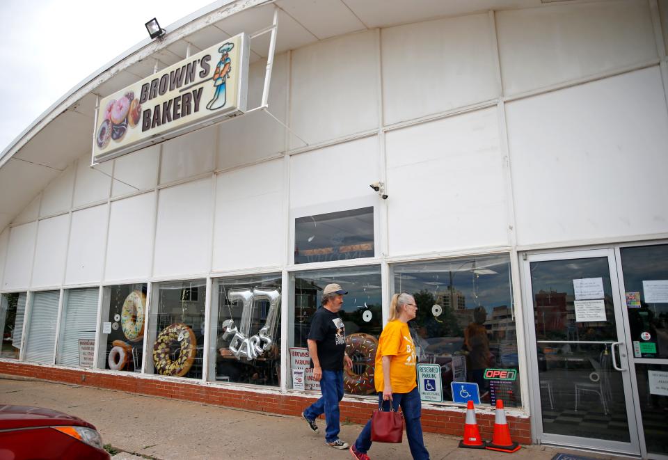 People walk in Brown's Bakery on its final day of business at the current location in Oklahoma City, Saturday, July, 8, 2023. 