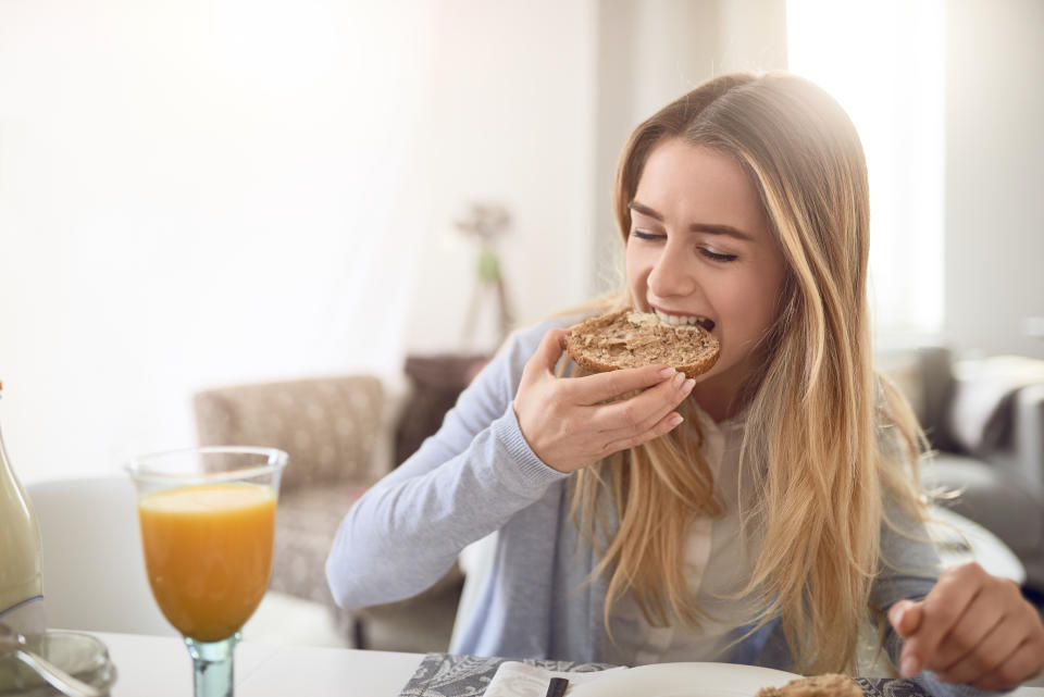 Pretty young girl eating Wholegrain bread