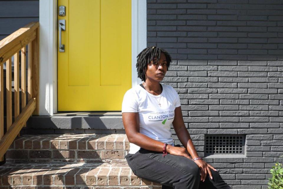 D’Asia Feaster sits outside her home in the West Boulevard corridor, the neighborhood she grew up in, which offers limited access to fresh and healthy food options. Feaster, along with others, is helping drive change through initiatives such as Three Sisters Market, a community-owned food cooperative.