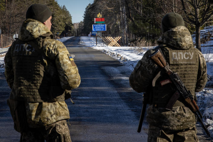 Members of the Ukrainian State Border Guard stand watch at the border crossing between Ukraine and Belarus on February 13, 2022, as Russian forces conduct large-scale military exercises in Belarus. / Credit: Getty Images