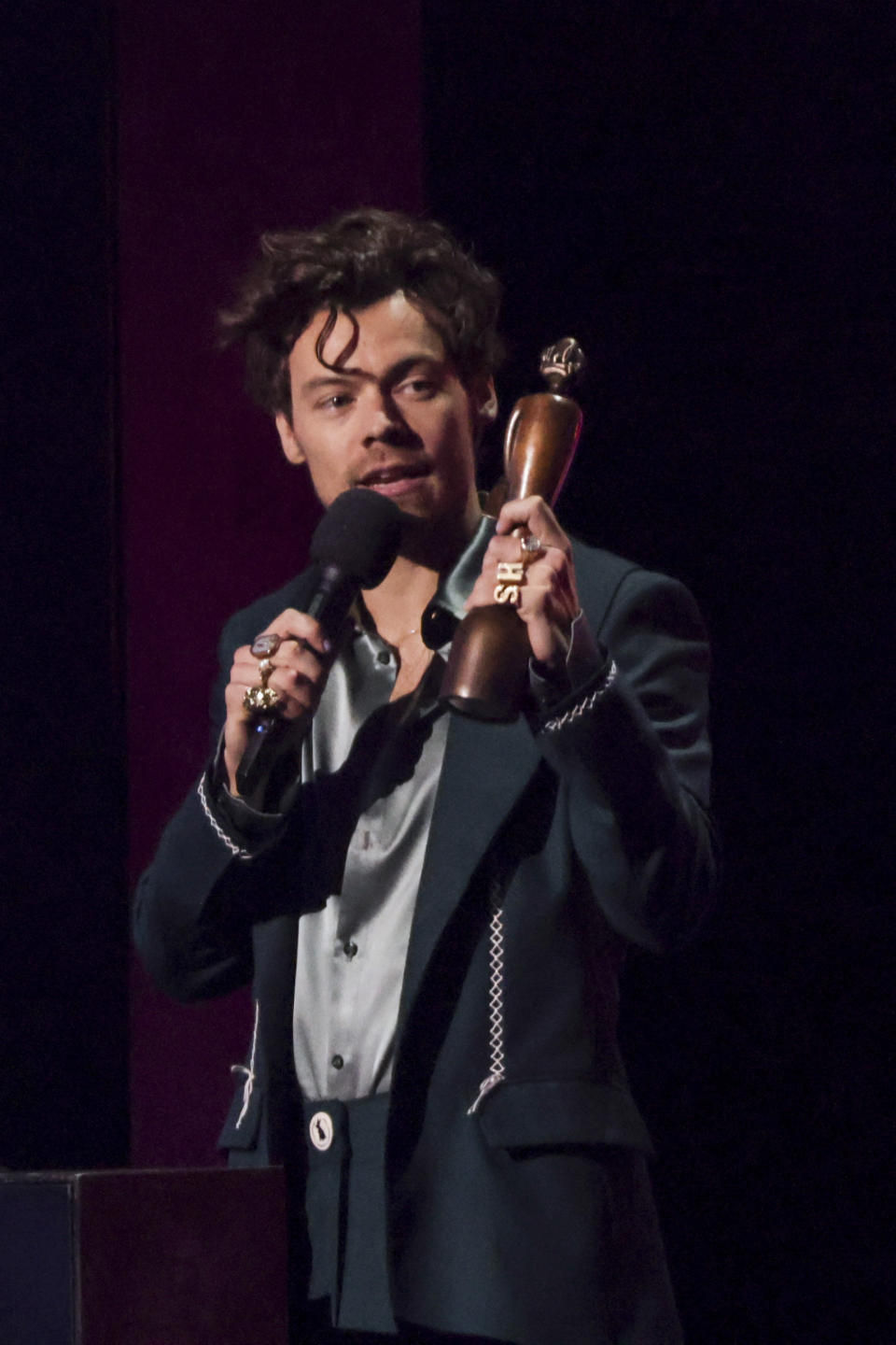 Harry Styles on stage accepting the award for Best Pop/R&B Act at the Brit Awards 2023 in London, Saturday, Feb. 11, 2023. (Photo by Vianney Le Caer/Invision/AP)